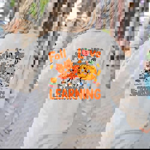 Fall In Love With Learning Thanksgiving Teacher Student Kids Women&#x27;s Sweatshirt Back Print - teacherstshirts.com