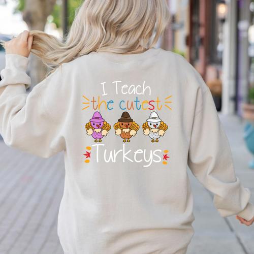 I Teach The Cutest Turkeys School Teachers Thanksgiving Women's Sweatshirt Back Print - teacherstshirts.com CA