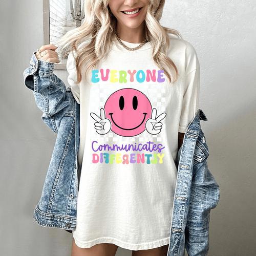 Everyone Communicates Differently Autism Awareness Teacher Women's Comfort Colors T-Shirt - teacherstshirts.com CA