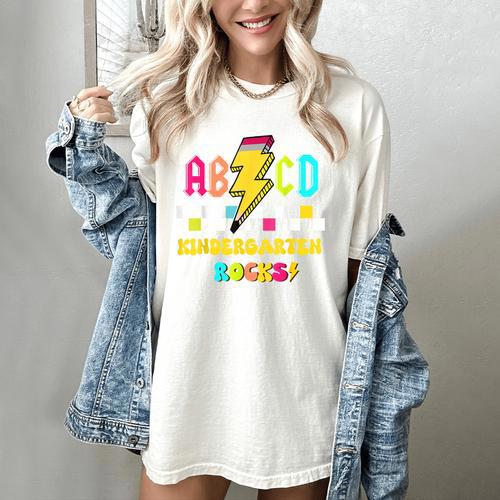Kindergarten ABCD Rocks Teacher Student Back To School Women's Comfort Colors T-Shirt - teacherstshirts.com DE