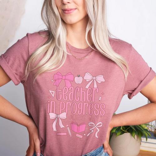 Women Teacher In Progress Coquette Pink Bow Future Teacher Women's Heather T-Shirt - teacherstshirts.com
