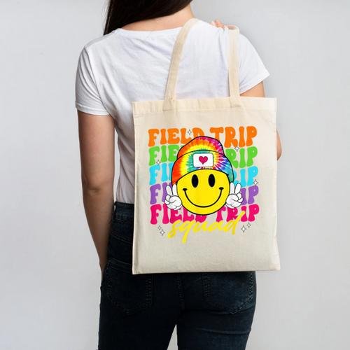Field Trip Squad Groovy Field Day Smile Face Teacher Tie Dye Canvas Tote Bag - teacherstshirts.com UK