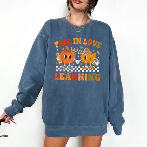 Fall In Love With Learning Autumn Pumpkin Fall Teacher Kids Comfort Colors Sweatshirt - teacherstshirts.com AU