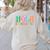 Hola Estudiantes Maestra Back To School Spanish Teacher Women's Sweatshirt Back Print Sand