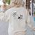 Skeleton Chasing Dog Boston Terrier Halloween Pet Lover Women's Sweatshirt Back Print Sand