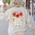 I Teach The Cutest Apples In The Orchard Cute Fall Teacher Women's Sweatshirt Back Print Sand