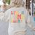 I Teach In My Pajamas Retro Groovy Teacher Humor Women's Sweatshirt Back Print Sand