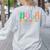 Hola Estudiantes Maestra Back To School Spanish Teacher Women's Sweatshirt Back Print Ash