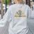 A New Chapter Begins Retired 2026 Teacher Retirement Women's Sweatshirt Back Print Ash A New Chapter Begins Retired 2026 Teacher Retirement Women's Sweatshirt Back Print Ash