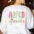 ABCD Kindergarten Rocks Pencil Lightning Teachers Rock Boys Women's Sweatshirt Back Print White