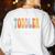 Toddler Teacher Retro Groovy Women Happy First Day Of School Women's Sweatshirt Back Print White