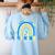 Be Kind Rainbow Down Syndrome Awareness Teacher Blue Yellow Women's Sweatshirt Back Print Light Blue