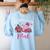 In October We Wear Pink Apple Teacher Daisy Breast Cancer Women's Sweatshirt Back Print Light Blue In October We Wear Pink Apple Teacher Daisy Breast Cancer Women's Sweatshirt Back Print Light Blue