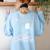 Read In Peace Skeleton Halloween Book Reading Spooky Teacher Women's Sweatshirt Back Print Light Blue