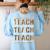 Teach Compassion Kindness Confidence History Teacher Women's Sweatshirt Back Print Light Blue