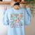 The Tired Teachers Department Retro Groovy Back To School Women's Sweatshirt Back Print Light Blue The Tired Teachers Department Retro Groovy Back To School Women's Sweatshirt Back Print Light Blue