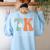 TK Teacher Retro Groovy Vintage Happy First Day Of School Women's Sweatshirt Back Print Light Blue