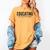 Educating Is Activism Feminist Social Justice Teacher For Men Women Women's Comfort Colors T-Shirt Mustard Educating Is Activism Feminist Social Justice Teacher For Men Women Women's Comfort Colors T-Shirt Mustard