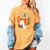 Fall Book Pumpkin Ghost Reading Books Halloween Teacher Women's Comfort Colors T-Shirt Mustard