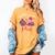 In October We Wear Pink Apple Teacher Daisy Breast Cancer Women's Comfort Colors T-Shirt Mustard In October We Wear Pink Apple Teacher Daisy Breast Cancer Women's Comfort Colors T-Shirt Mustard