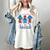 All American Teacher Pencil Coquette Bow USA Flag Teachers Women's Comfort Colors T-Shirt Ivory All American Teacher Pencil Coquette Bow USA Flag Teachers Women's Comfort Colors T-Shirt Ivory