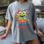 Feed The Reading Monster Halloween Teacher Women's Comfort Colors T-Shirt Gray Feed The Reading Monster Halloween Teacher Women's Comfort Colors T-Shirt Gray