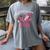 In October We Wear Pink Apple Teacher Daisy Breast Cancer Women's Comfort Colors T-Shirt Gray In October We Wear Pink Apple Teacher Daisy Breast Cancer Women's Comfort Colors T-Shirt Gray