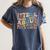 I Tell Young People About Dead People Groovy History Teacher Women's Comfort Colors T-Shirt Denim I Tell Young People About Dead People Groovy History Teacher Women's Comfort Colors T-Shirt Denim