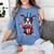 Boston Terrier Puppy Dog Holds His American Flag 4th Of July Women's Comfort Colors T-Shirt Blue Jean