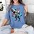 Boston Terrier Riding T-Rex Dinosaur Dog Lover Women's Comfort Colors T-Shirt Blue Jean