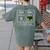 First Caffeinate Then Educate I Am Earning A Break Teacher Women's Comfort Colors T-Shirt Back Print Moss