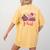 In October We Wear Pink Apple Teacher Daisy Breast Cancer Women's Comfort Colors T-Shirt Back Print Mustard