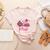 In October We Wear Pink Apple Teacher Daisy Breast Cancer Women's Heather T-Shirt Heather Peach