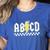 ABCD Teacher Women's Heather T-Shirt Heather True Royal