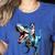 Boston Terrier Riding T-Rex Dinosaur Dog Lover Women's Heather T-Shirt Heather True Royal