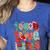 Christmas Coquette Bow Teacher Teach Love Inspire Women's Heather T-Shirt Heather True Royal Christmas Coquette Bow Teacher Teach Love Inspire Women's Heather T-Shirt Heather True Royal