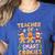 Christmas Teacher Of Smart Cookies Gingerbread Man Teaching Women's Heather T-Shirt Heather True Royal Christmas Teacher Of Smart Cookies Gingerbread Man Teaching Women's Heather T-Shirt Heather True Royal