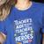 Educators Teacher's Aide Because Even Teachers Need Heroes Women's Heather T-Shirt Heather True Royal