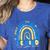 Be Kind Rainbow Down Syndrome Awareness Teacher Blue Yellow Women's Heather T-Shirt Heather True Royal