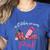 In October We Wear Pink Apple Teacher Daisy Breast Cancer Women's Heather T-Shirt Heather True Royal