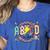 Retro ABCD Transitional Kindergarten Teacher Tour TK Teacher Women's Heather T-Shirt Heather True Royal
