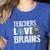 Teachers Love Brains Zombie Halloween Hilarious Women's Heather T-Shirt Heather True Royal