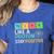 Think Like A Proton Stay Positive Science Teacher Women's Heather T-Shirt Heather True Royal