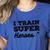 I Train Superheroes For Teacher Coach Men Women Women's Heather T-Shirt Heather True Royal I Train Superheroes For Teacher Coach Men Women Women's Heather T-Shirt Heather True Royal