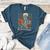 Read In Peace Skeleton Reading Book Halloween Teacher Women's Heather T-Shirt Heather Deep Teal