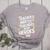Educators Teacher's Aide Because Even Teachers Need Heroes Women's Heather T-Shirt Athletic Heather