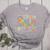Groovy Play Is Learning Kindergarten Teacher Appreciation Women's Heather T-Shirt Athletic Heather Groovy Play Is Learning Kindergarten Teacher Appreciation Women's Heather T-Shirt Athletic Heather