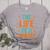 The Life Of A Teacher Women's Heather T-Shirt Athletic Heather