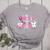 In October We Wear Pink Ballet Ghost Teacher Breast Cancer Women's Heather T-Shirt Athletic Heather In October We Wear Pink Ballet Ghost Teacher Breast Cancer Women's Heather T-Shirt Athletic Heather
