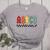 Rock Abcd Back To School Abcd Preschool Teacher Appreciation Women's Heather T-Shirt Athletic Heather Rock Abcd Back To School Abcd Preschool Teacher Appreciation Women's Heather T-Shirt Athletic Heather